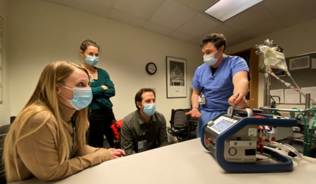 Students with instructor in medical room